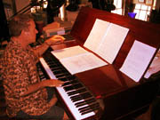 David Del Tredici sits at a piano